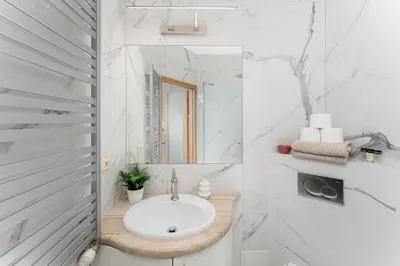 a bathroom with a sink and a mirror at Near Wawel Castle in Kraków