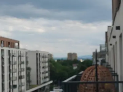 a view of a city from a balcony with buildings at Quiet in the City Wrocławska in Kraków