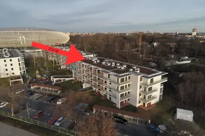 an aerial view of a building with a red arrow at Malila Premium Apartments Cracow Tauron Arena Lema 15E in Kraków