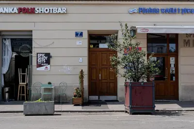 a building with a plant in front of it at Old Market View Premium Standard with AC in Kraków