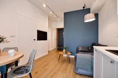 a kitchen and living room with a table and chairs at Flower Blue 2 by Housine in Zator