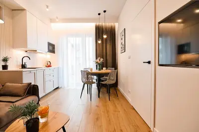 a kitchen and living room with a table and a couch at Flower Blue 2 by Housine in Zator