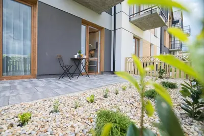 a house with a courtyard with a table and chairs at Flower Blue 2 by Housine in Zator