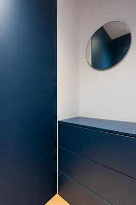 a blue dresser with a mirror on top of it at Przestronny apartament PARKING by NEARTOpl in Kraków