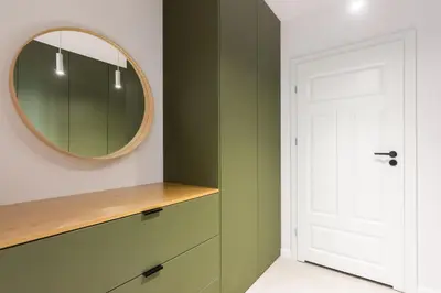 a dressing room with a mirror and a dresser at Przestronny apartament PARKING by NEARTOpl in Kraków