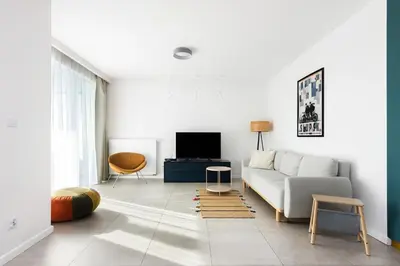a living room with a couch and a tv at Przestronny apartament PARKING by NEARTOpl in Kraków