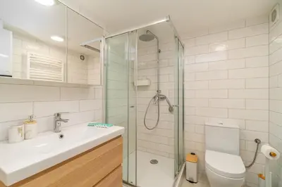 a bathroom with a shower and a sink and a toilet at Kraków Kazimierz - Top Location, Entresol - by Rentujemy in Kraków