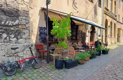 a bike parked next to a building with plants at Quiet Studio in the heart of Kazimierz AC in Kraków