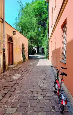 a bike parked on the side of a street at Quiet Studio in the heart of Kazimierz AC in Kraków