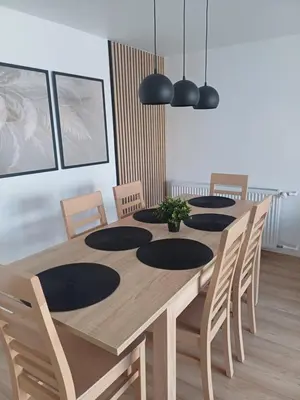 a wooden table with chairs and a dining room at Wieliczka4You in Wieliczka
