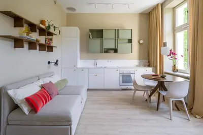 a living room with a couch and a table at lovely place, modern design, historic townhouse in Kraków