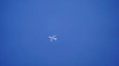 an airplane flying in the sky at Close to Main Square in Kraków