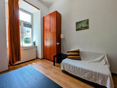 a bedroom with a bed and a window at Krowoderska 53 by Homeprime in Kraków