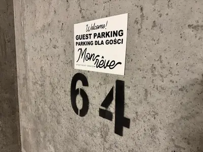 a sign that says guest parking parking data collected at Mon Rêve in Kraków