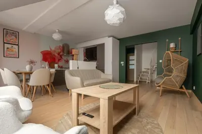 a living room with a couch and a table at Apartament na Skarpie in Rabka