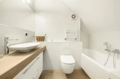 a bathroom with a sink and a toilet and a tub at Apartament na Skarpie in Rabka