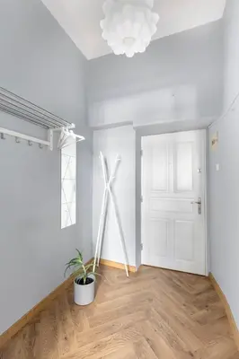 a room with a wind turbine in the corner of a room at ANTA Apartments Warszawska in Kraków