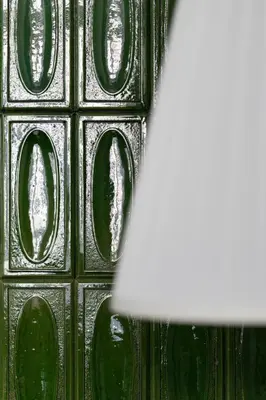 a close up of a glass window with a lamp at ANTA Apartments Warszawska in Kraków