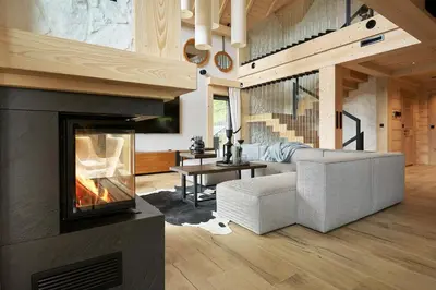 a living room with a fireplace and a couch at Arete' 710 Stryszawa in Stryszawa