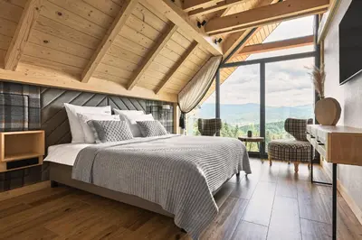 a bedroom with a bed and a large window at Arete' 710 Stryszawa in Stryszawa