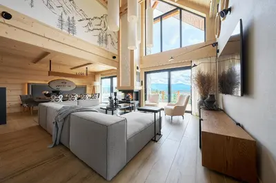 a living room with a large couch and a table at Arete' 710 Stryszawa in Stryszawa