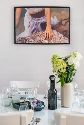a table with a picture of a woman dancing at Spacious Apartment in Krakow Old Town in Kraków