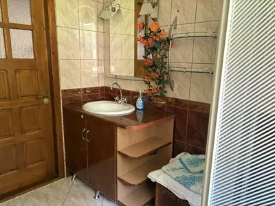 a bathroom with a sink and a mirror at Noclegi w Beskidzie Wyspowym in Przenosza