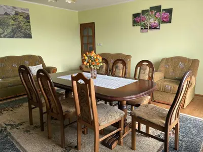a dining room with a table and chairs at Noclegi w Beskidzie Wyspowym in Przenosza