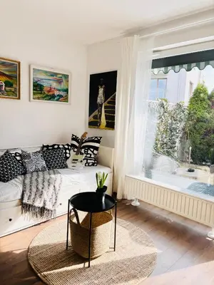 a shelf with blue glass jars on it at Bronowice Art Garden - Cozy Apartment with Garden and Parking in Kraków