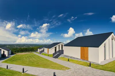 an architectural rendering of a house with a driveway at Panorama Resort in Radocza