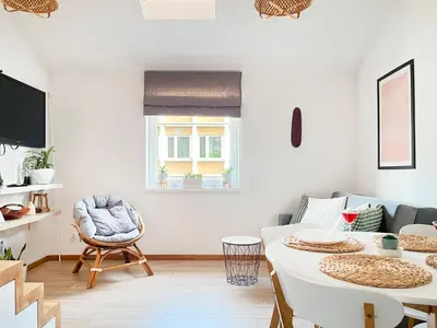 a living room with a table and a couch at Modern Apartments with Air Conditioning, Vistula Boulevards, Cracow city heart in Kraków