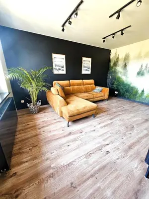 a large living room with a couch and a table at Willa za Zeliną