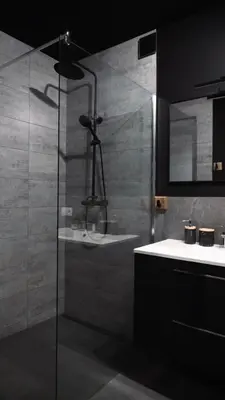 a bathroom with a glass shower and a sink at Willa za Zeliną