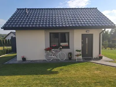 a bike parked in front of a small house at Domek u Oli - blisko Energylandia, Wadowice, Kraków, Oświęcim in Bachowice