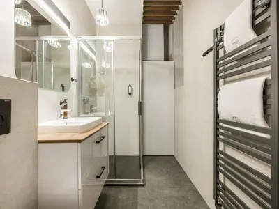 a bathroom with a shower and a sink at Fragola Apartments Florian Gate in Kraków