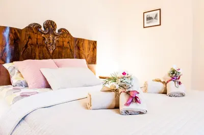 a bedroom with two beds with flowers on them at Apartments Roman in Kraków