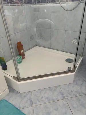 a shower with a glass door on a bathroom at Rooms near Balice airport in Cholerzyn