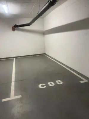 an empty parking garage with a sign on the floor at Mieszkanie do wynajęcia Rydlówka Kraków in Kraków