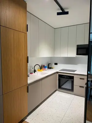 a kitchen with white cabinets and a sink at Mieszkanie do wynajęcia Rydlówka Kraków in Kraków