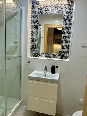 a bathroom with a sink and a mirror at Vintage Studencka 25 Apartment in Kraków