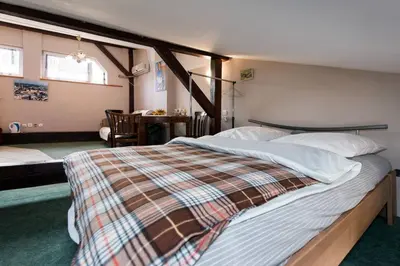 a bedroom with a large bed in a room at Love Bridge Apartments in Kraków