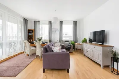 a living room with a couch and a table at Jasmine's apartment in Kraków