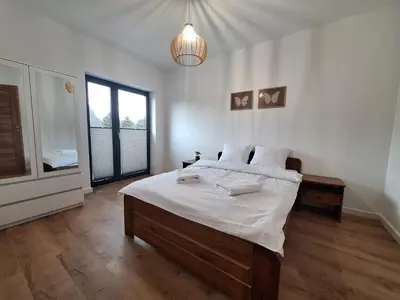 a hallway with a stairway leading to a bathroom at Magic Apartments - Zatoria in Zator