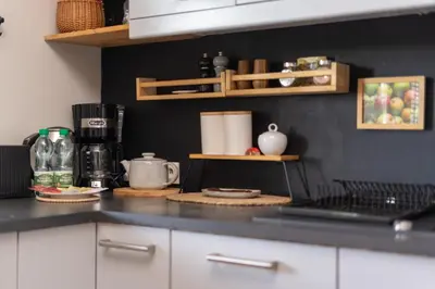 a kitchen with a counter top with a coffee maker at Przewóz Charming Nest Apartment by BookingHost in Kraków