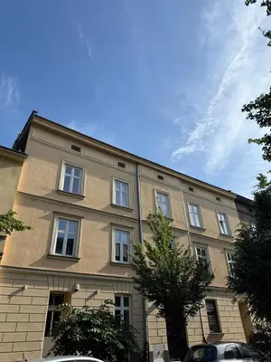 a large building with many windows on the side of it at Szlak Loft in Kraków