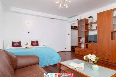 a living room with a bed and a couch at Krupnicza Family Studio with AC Quiet Krakow Old Town by Noclegi Renters in Kraków