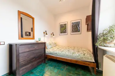 a room with a blue floor with a table and chairs at New World apartment 54m, Kazimierz old town of Cracow in Kraków