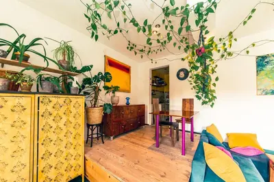 a living room with a blue couch and a table at New World apartment 54m, Kazimierz old town of Cracow in Kraków