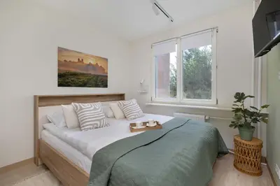 a bedroom with a bed and a window at Family Apartment with Air Conditioning with 3 Bedrooms in Cracow by Noclegi Renters in Kraków
