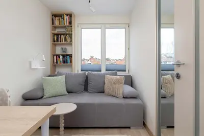 a living room with a couch and a table at Family Apartment with Air Conditioning with 3 Bedrooms in Cracow by Noclegi Renters in Kraków